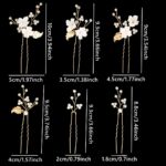 Close-up of 6 ornate gold leaf and flower pearl bridal hair pins, scattered on a soft white background.