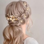 Close-up of 7 gold leaf and pearl wedding hair pins, showcasing intricate details and varying styles.
