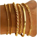 Six 14K gold plated bracelets, including herringbone, Cuban, and paperclip chains, displayed together.