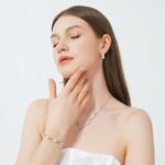 Close-up of a GZWHD white gold plated brass bridal jewelry set with cubic zirconia necklace, earrings, and bracelet.
