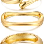 Three iF YOU 14K gold plated chunky bangle bracelets stacked together on a wrist, showing their round shape.