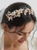 Close-up of a gold SWEETV bridal headband featuring delicate flower and leaf designs with pearls and rhinestones.