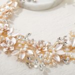 Close-up of a gold SWEETV bridal headband featuring delicate flower and leaf designs with pearls and rhinestones.