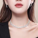 Close-up of a Tatibana Crystal Wedding Jewelry Set featuring a silver necklace and matching earrings with sparkling crystals.