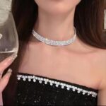 Close-up of a Tatibana Crystal Wedding Jewelry Set featuring a silver necklace and matching earrings with sparkling crystals.
