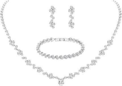 Close-up of a silver-plated necklace and matching earrings adorned with clear round rhinestones, presented in a gift box.